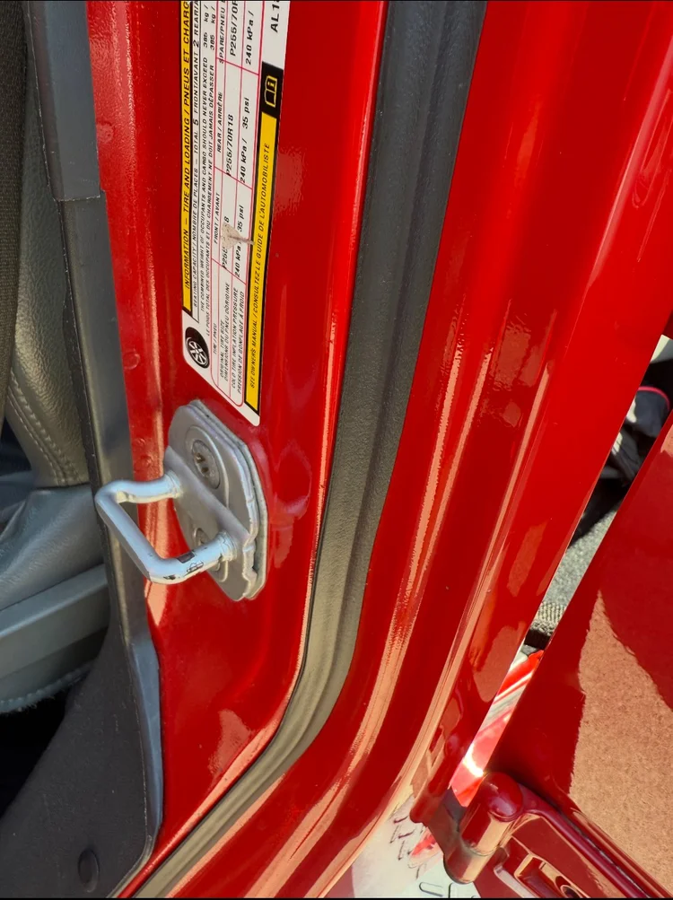 Close-up Jeep door opening showing the body-side seal contact area