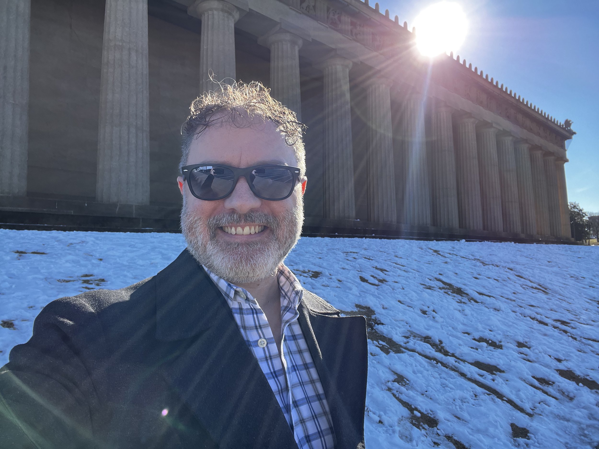 Author standing in front of Nashville's Parthenon in the snow