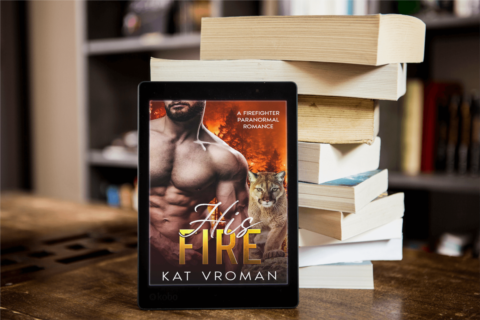 His Fire by Kat Vroman on tablet with stack of books
