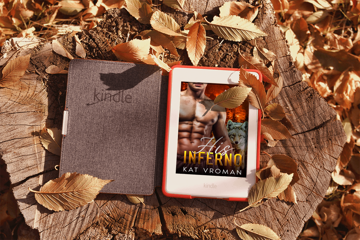His Inferno by Kat Vroman on tablet with kindle case open on tree stump with dry leaves