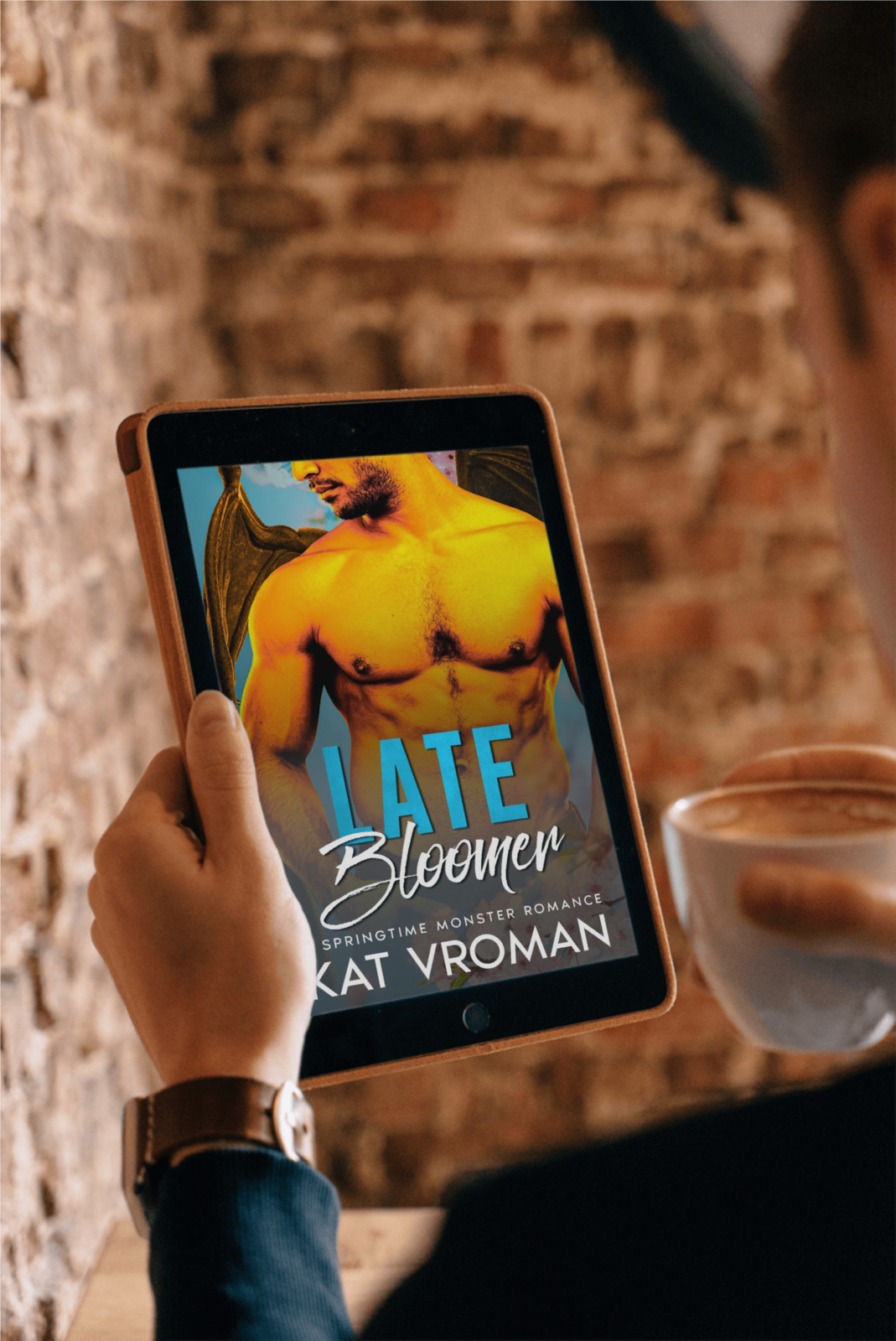 Late Bloomer by Kat Vroman on tablet being held with coffee