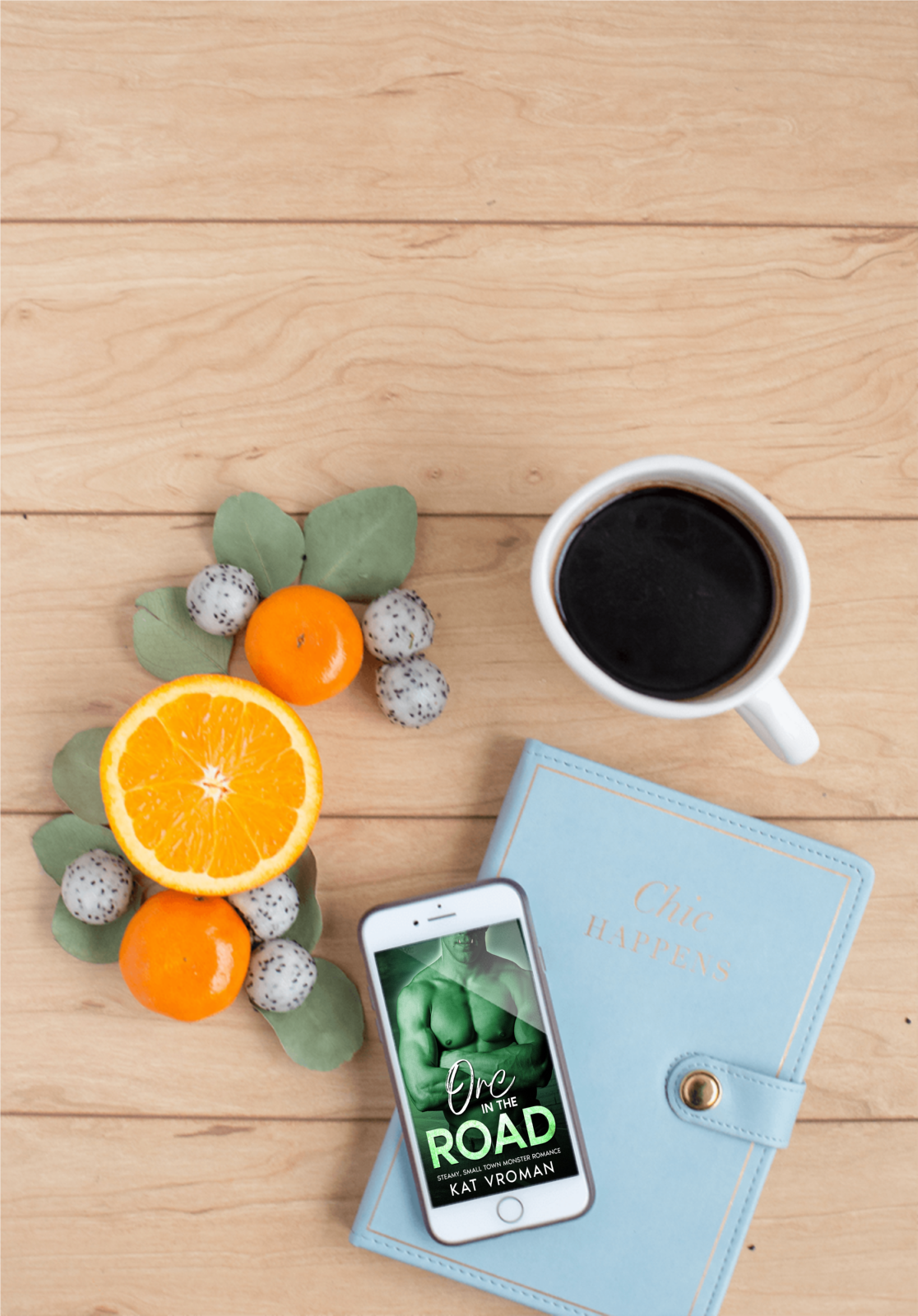 Orc in the Road by Kat Vroman on phone, fruit, coffee, blue book