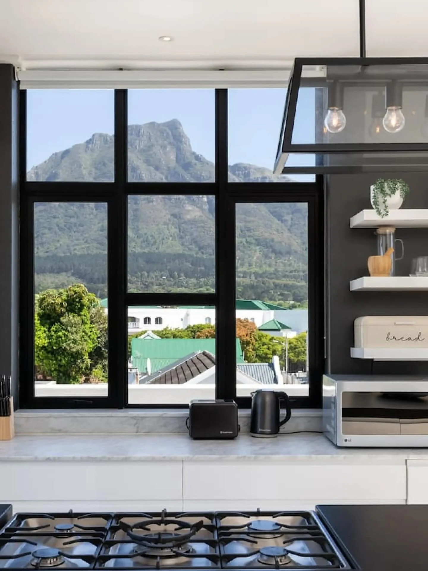 Wake up to Cape Town&rsquo;s most iconic views 

This breathtaking apartment captures the magic of the city &mdash; with wraparound patios, floor-to-ceiling windows, and uninterrupted mountain vistas from every room. Cook, unwind, or soak in the tub 
