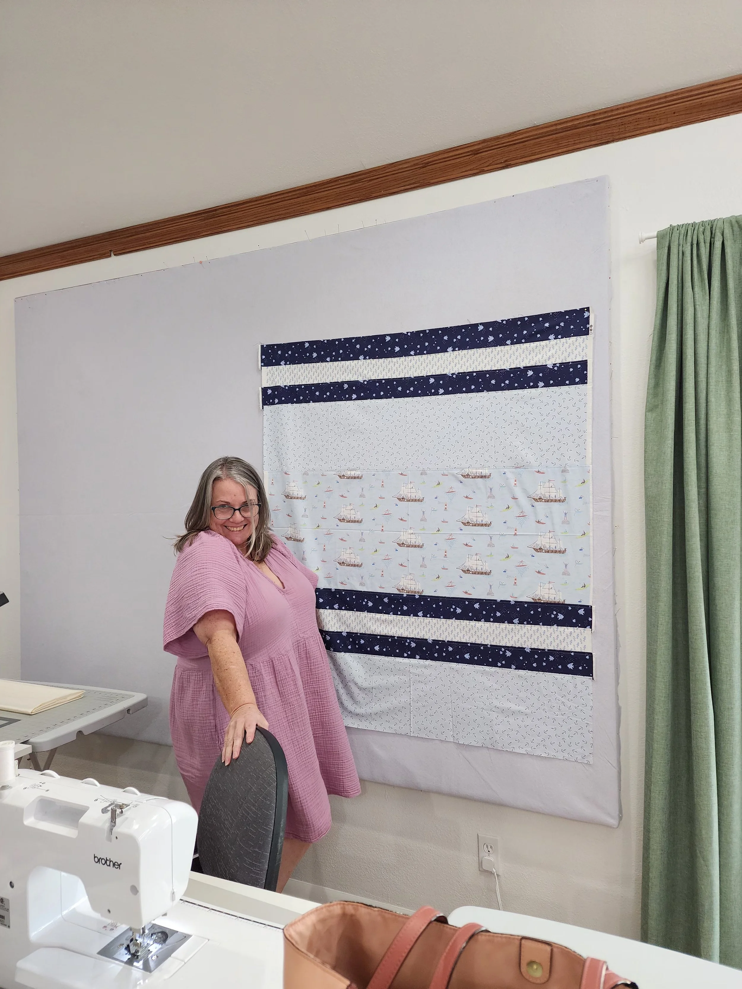 Jana posing with her quilt top