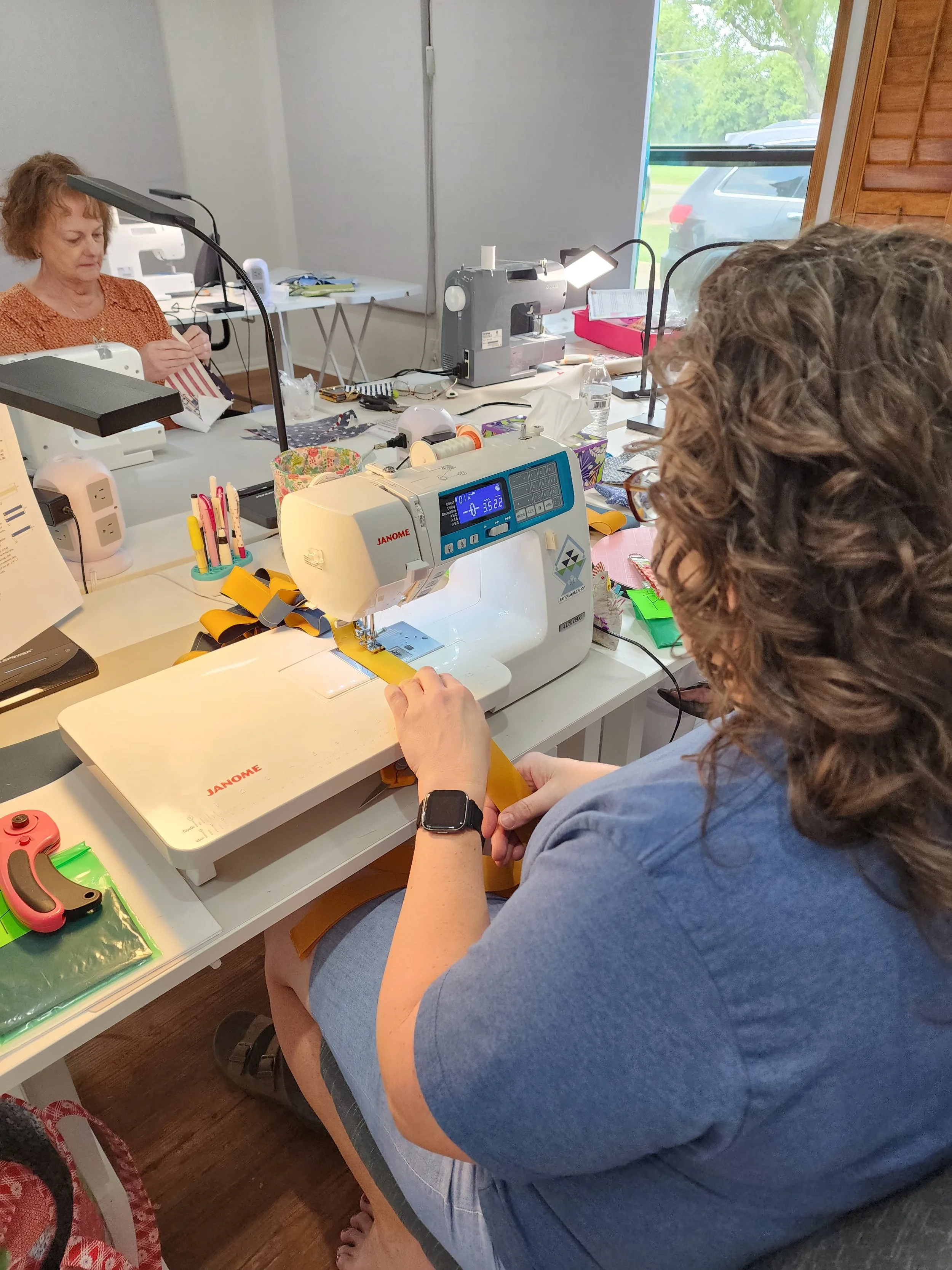 Tina and Emma sewing