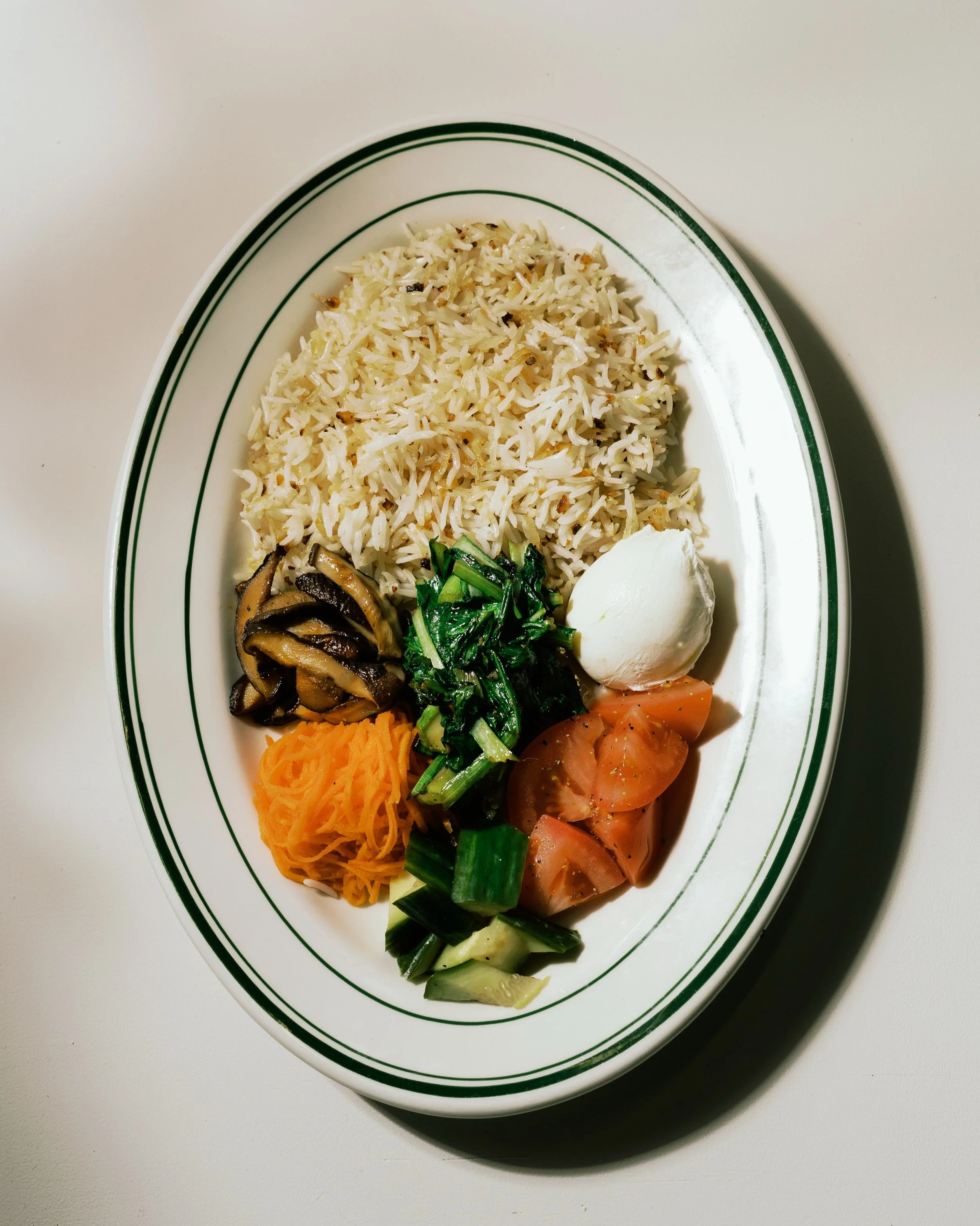 Basmati Sinangag &mdash; definitely a breakfast for champions.

Vegetarian, gluten-free, dairy-free, and high in fibre. Served with eggs from @trueggs, @orasfarm shiitake mushrooms, fresh grated carrots, saut&eacute;ed eastern greens, fresh tomatoes,