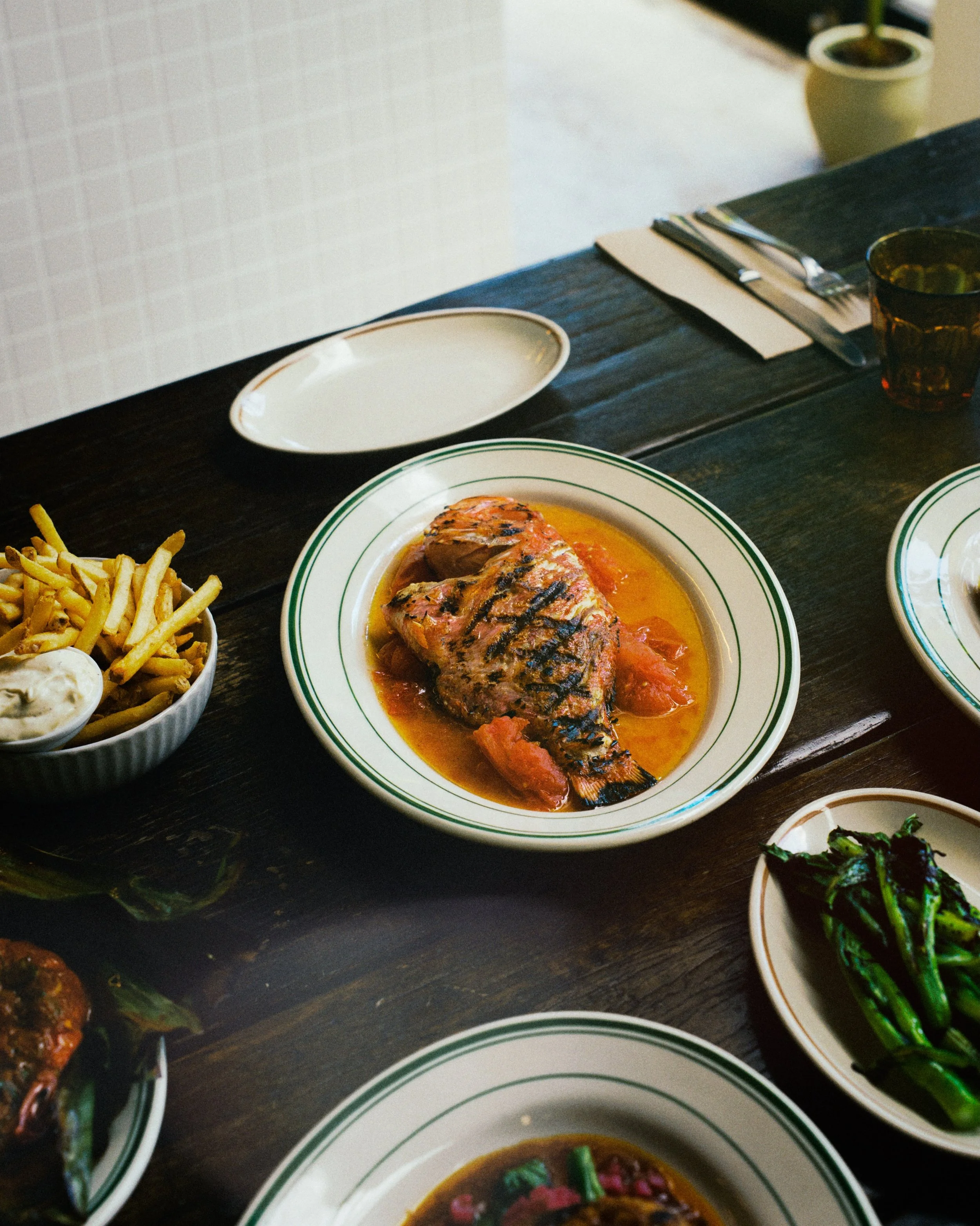 Grilled Fish with Steamed Tomatoes &amp; Soy Sauce

Growing up, my Nanay would slip tomatoes into the rice cooker to steam alongside the rice. Once softened, she&rsquo;d macerate them with a splash of soy sauce and serve them with freshly cooked rice