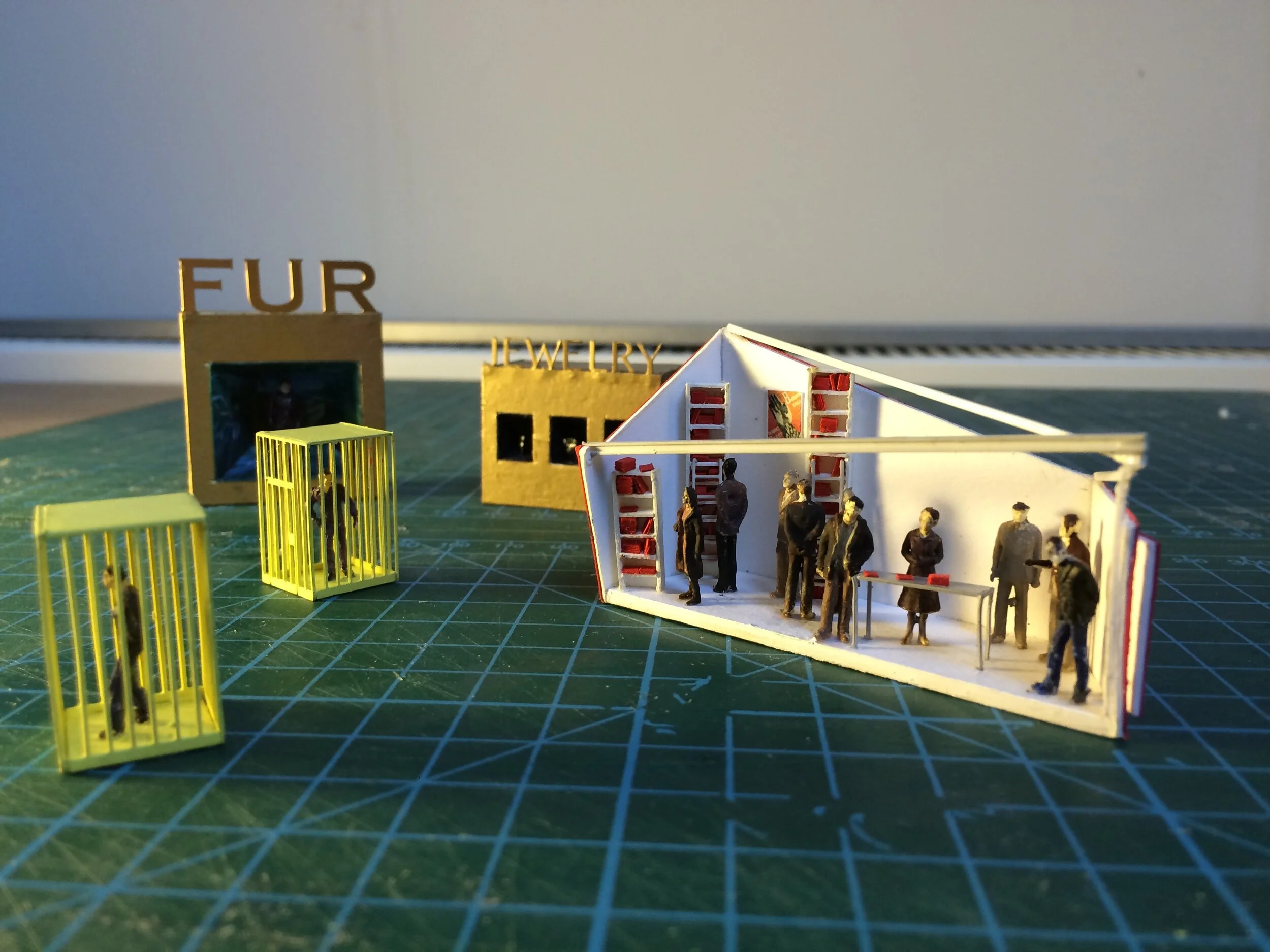 Scale model pieces at 1:100.