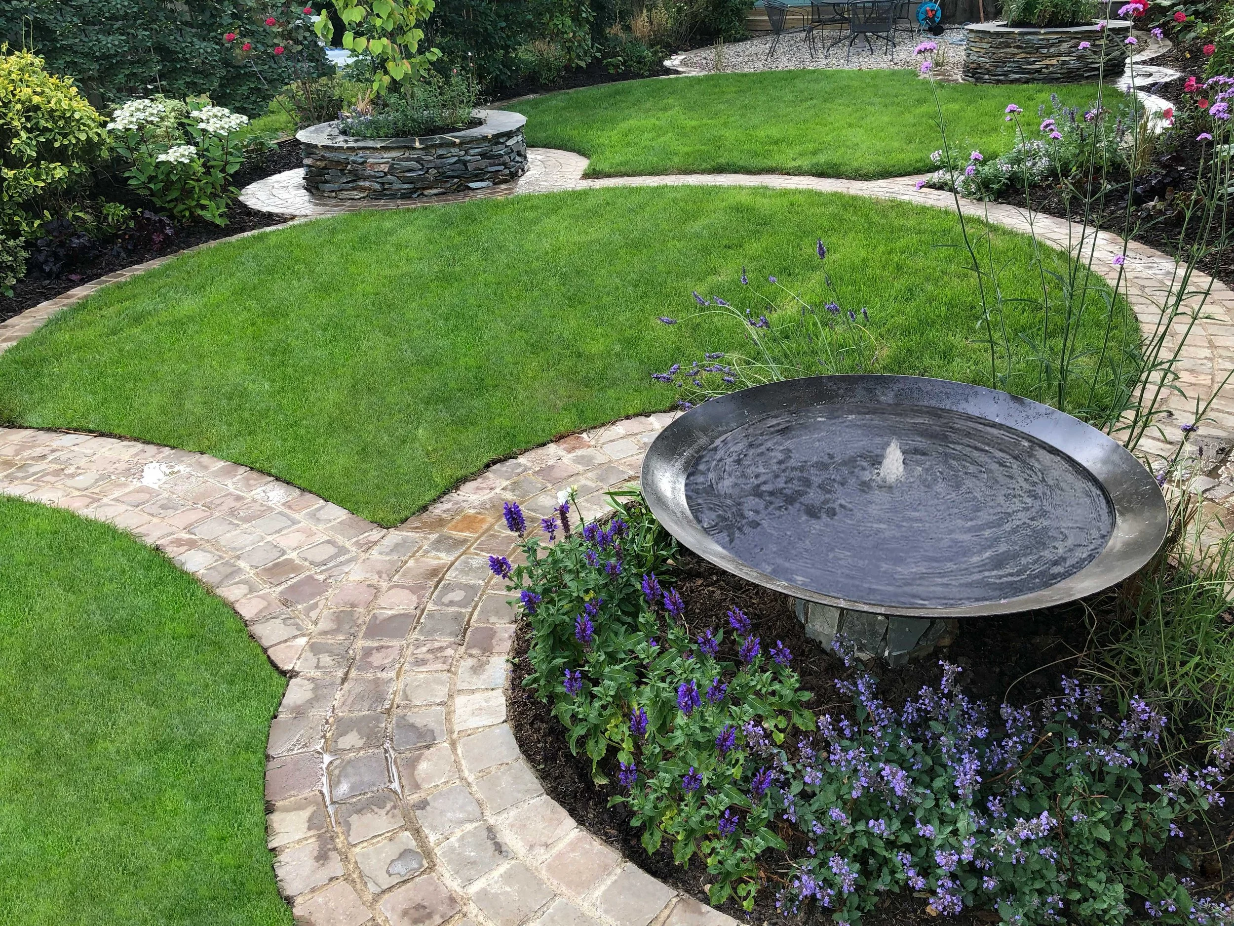 Corten steel water feature with under planting