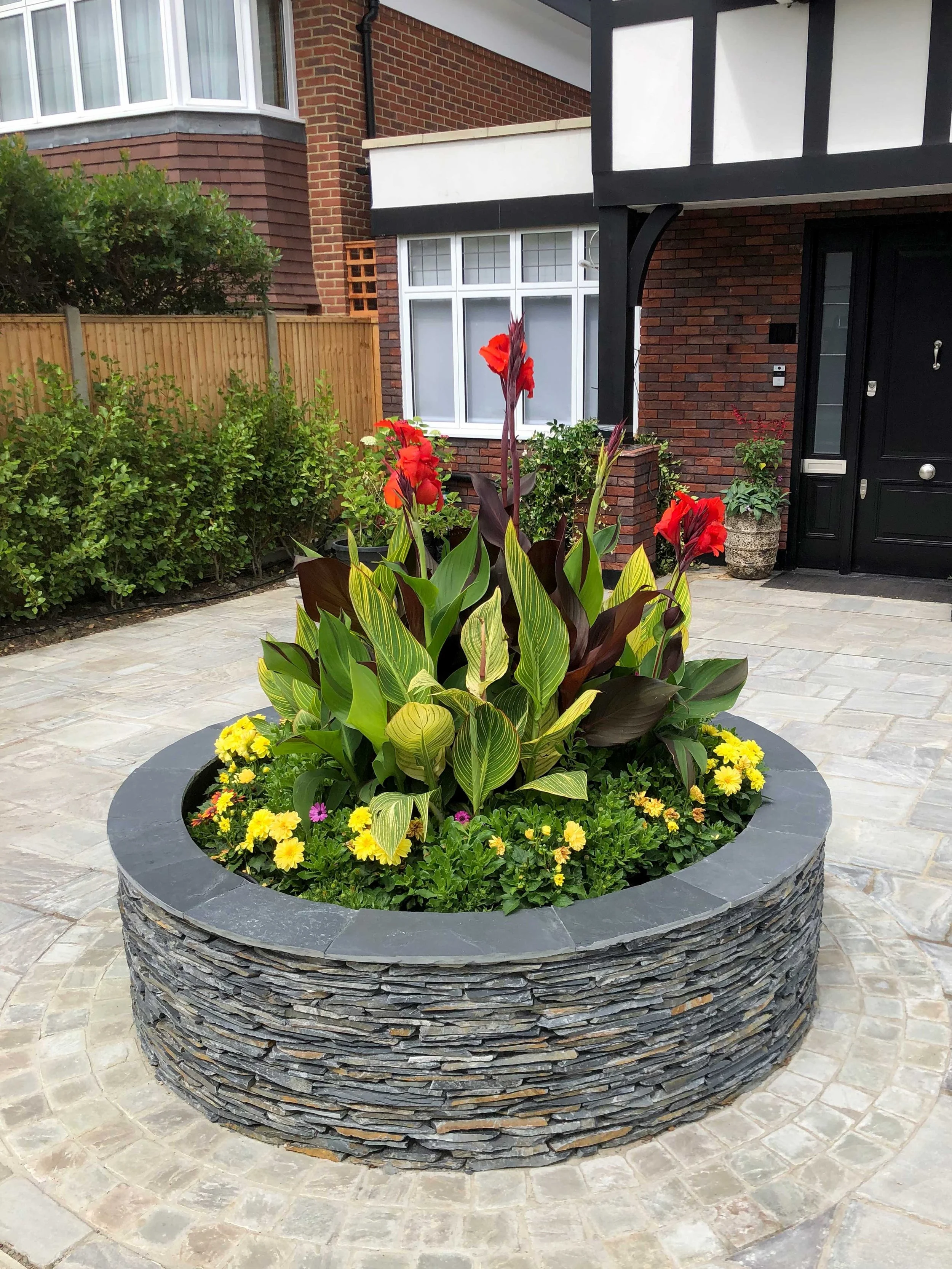 Raised feature displays in the front garden get very positive feedback from the local community