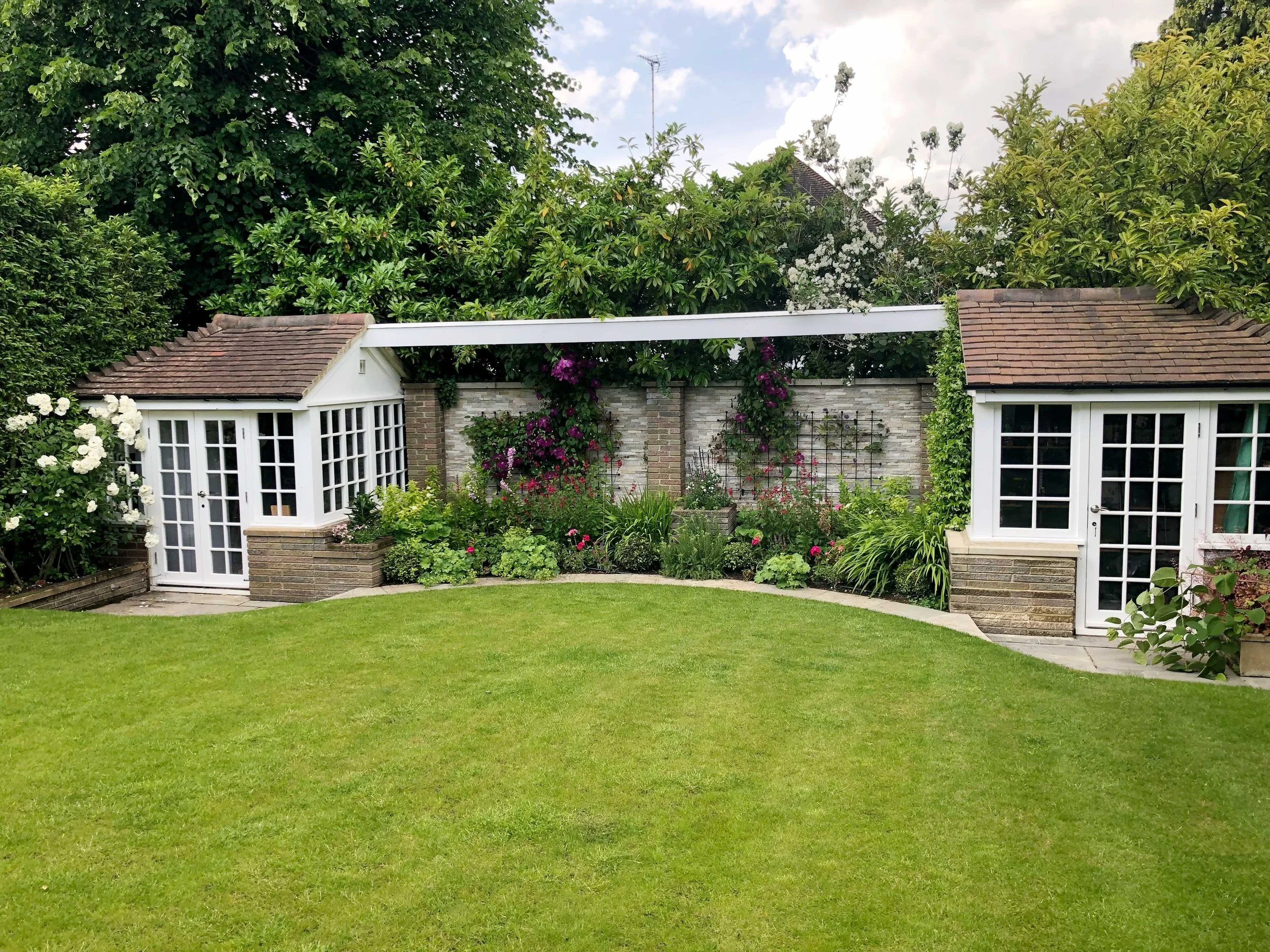 Clear vista across new lawn to planting beds at rear create an attractive view
