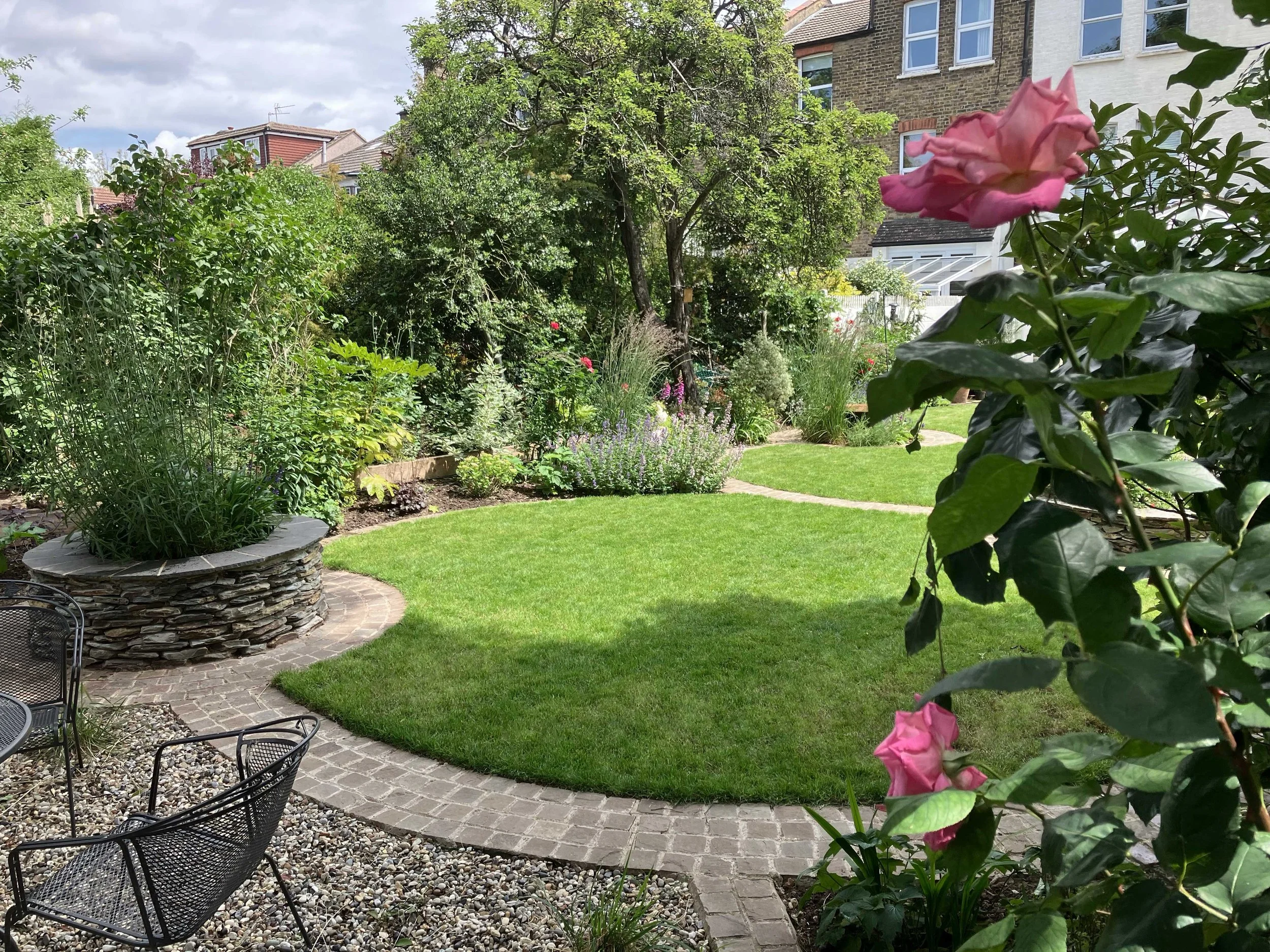 View from seating area back through garden