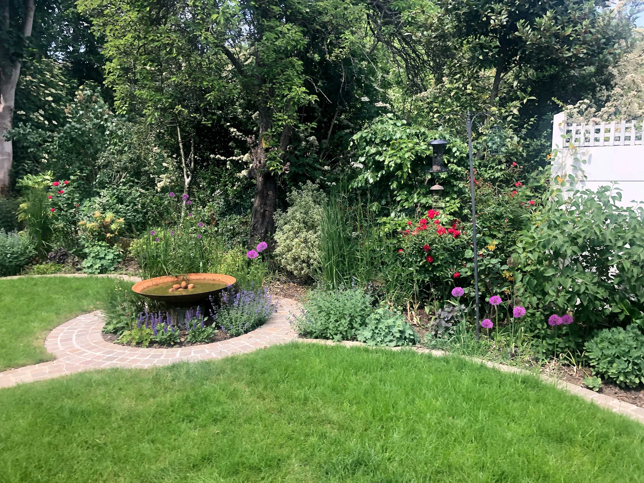 View of lawn and corten steel water feature