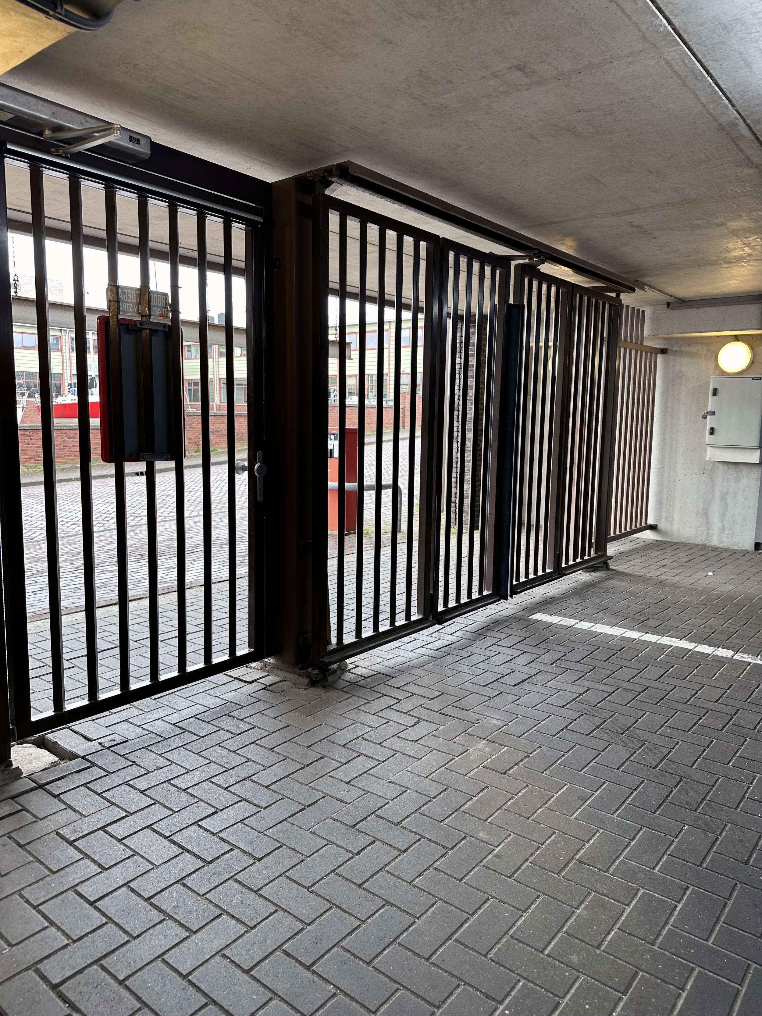 Parking garage gated entrance inside.png