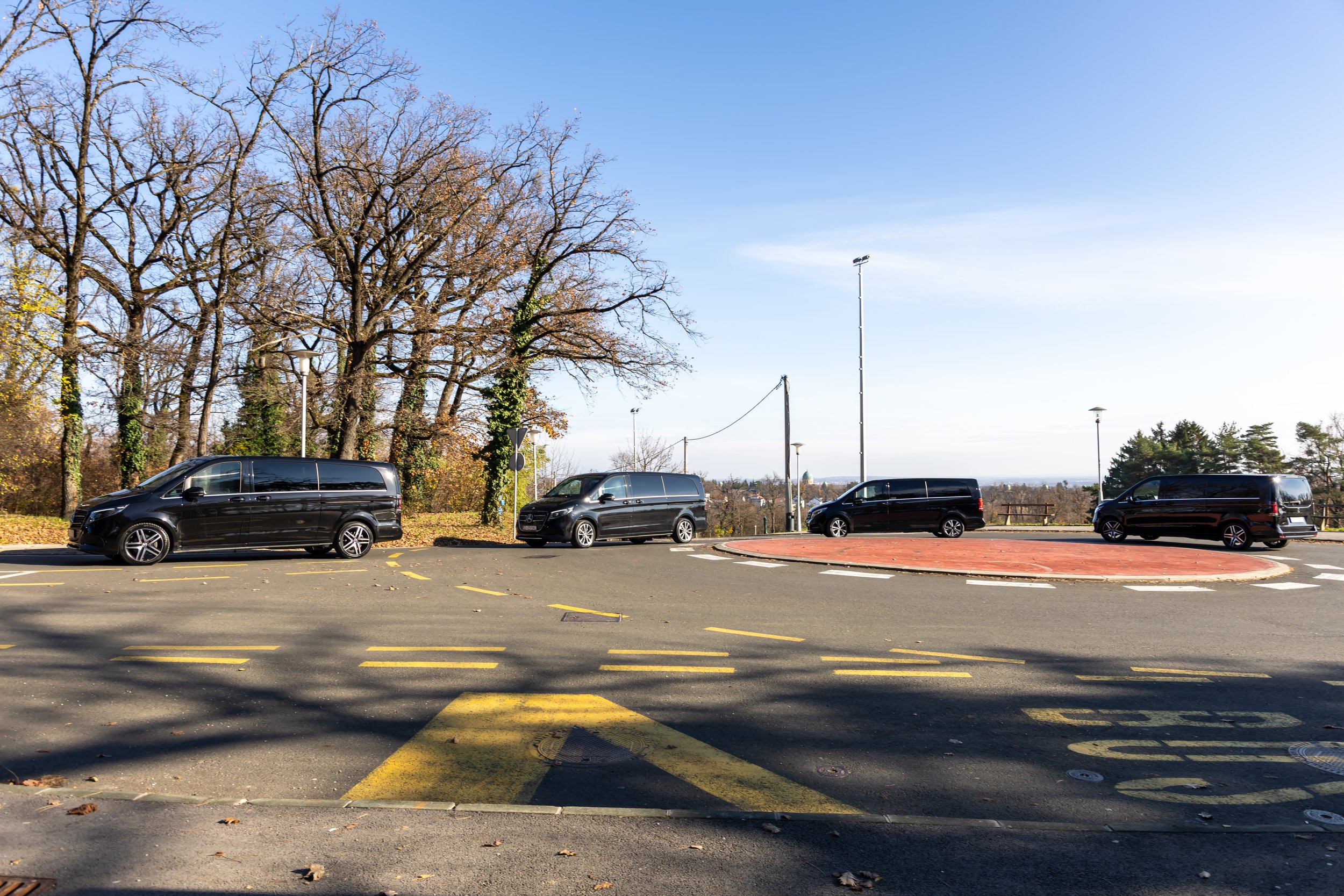 Private jet ground transportation service with professional chauffeur at a General Aviation terminal.