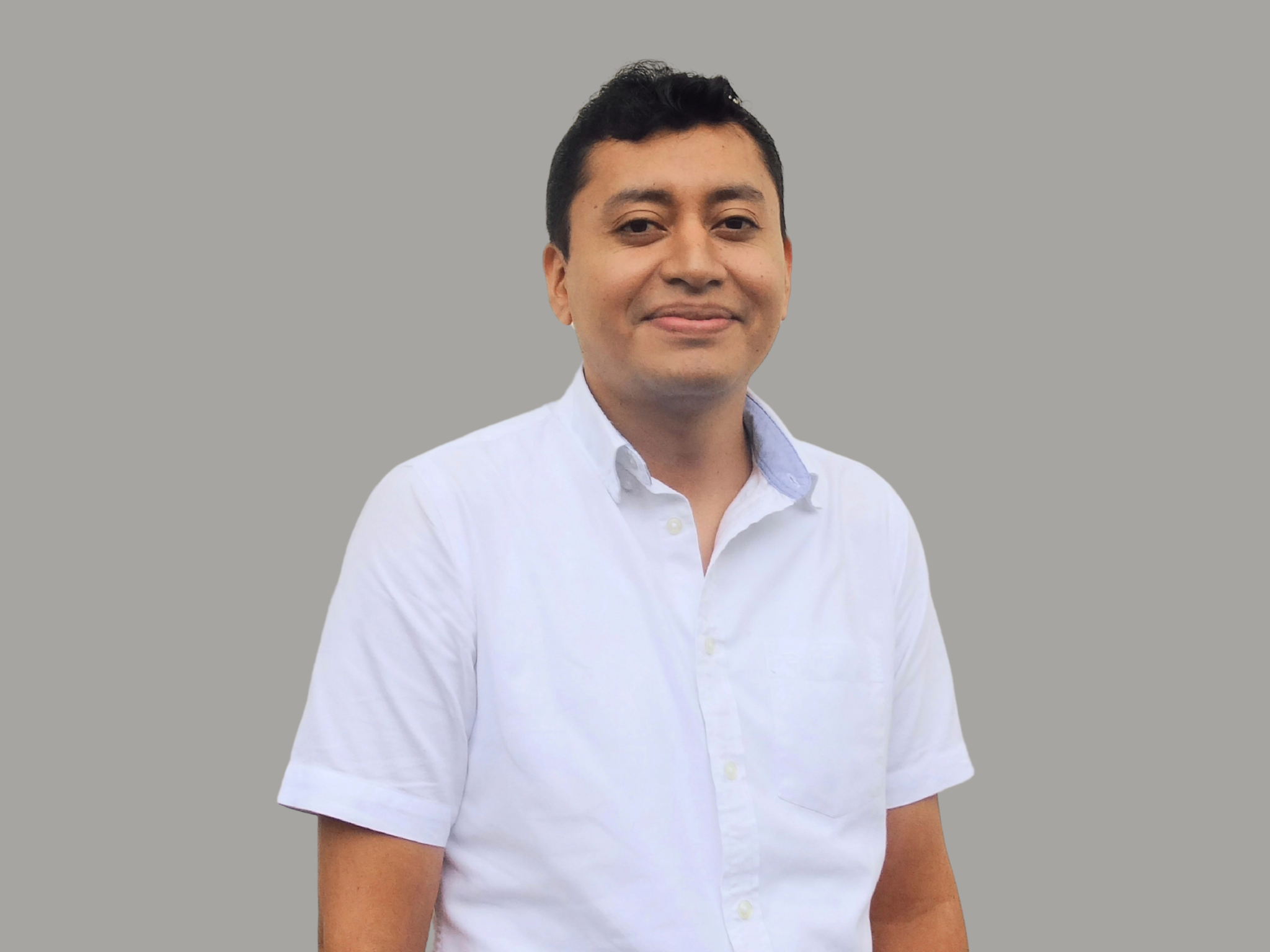 erick ortiz, quiality assurance manager, smiling and looking at the camera. operations team member