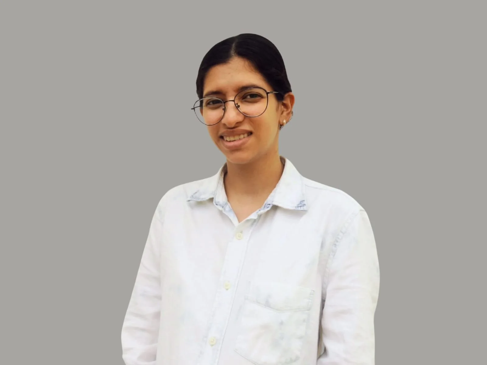 maria matus, smiling and looking at the camera. operations team member