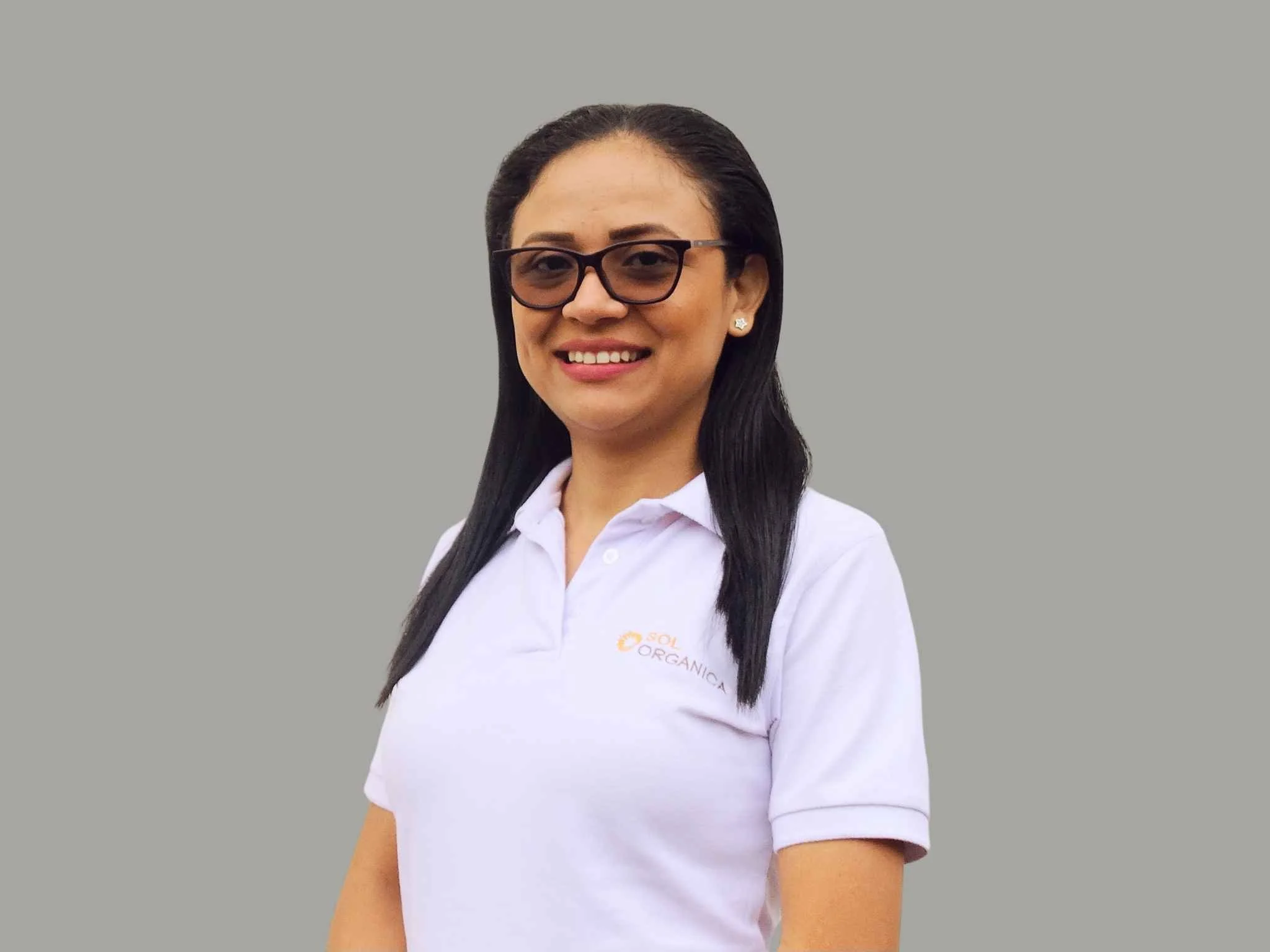 Aryeris Chávez  Head of Collection, smiling and looking at the camera. operations team member