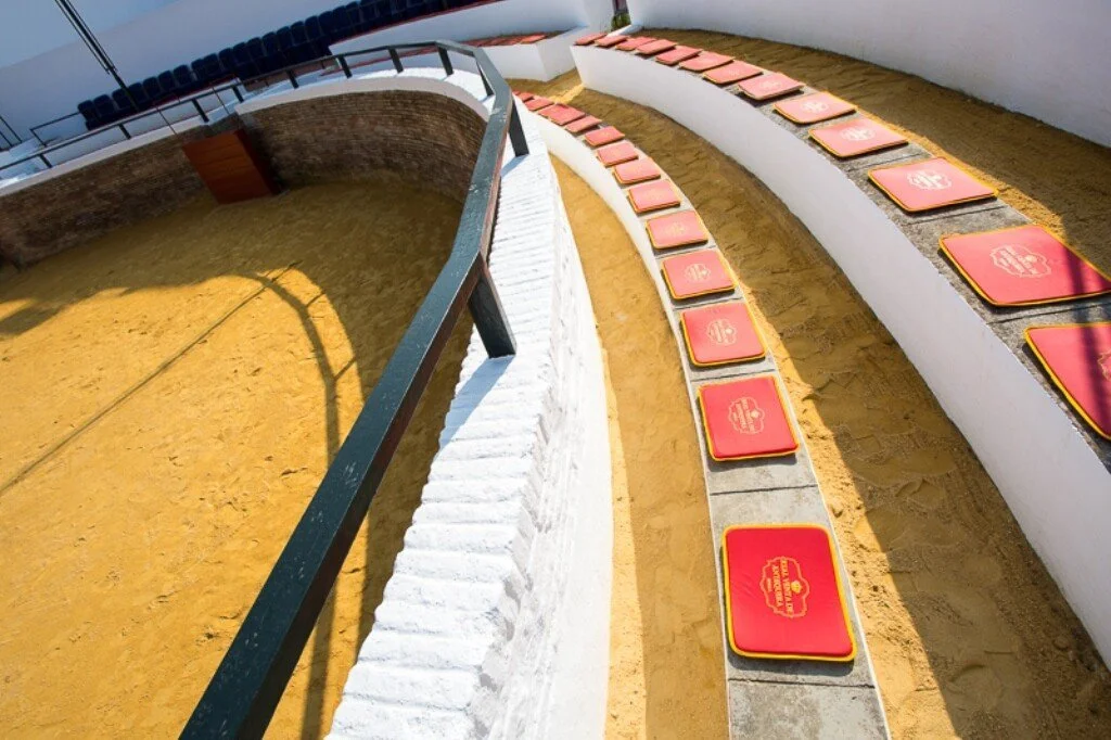 Bullring seating with cushions for guests at the event