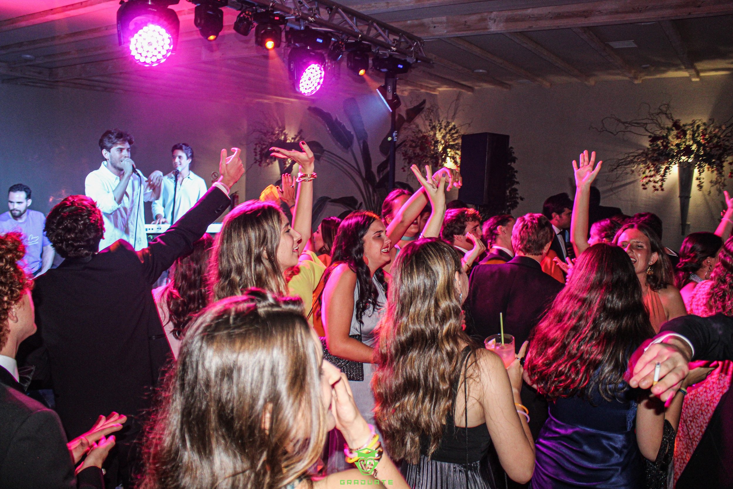 Concert at an open bar party with dancing youths