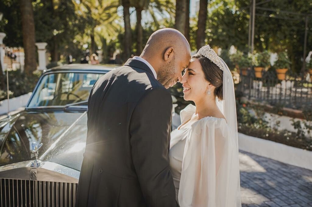 Bride and groom posing in romantic garden of sevilla events
