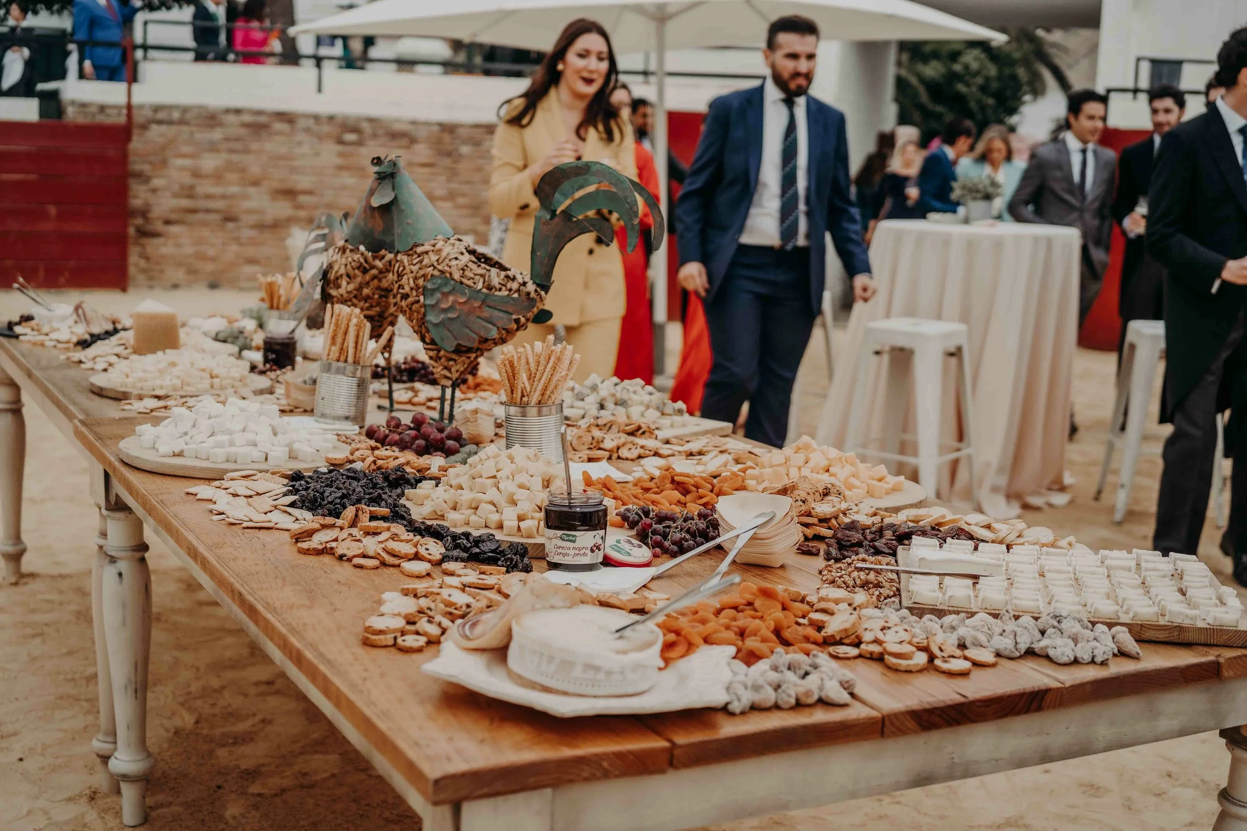 Entrance of guests at wedding reception with cheese appetizer table