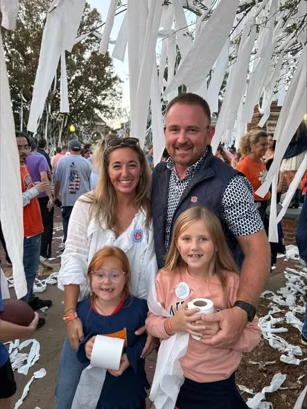 Penelope and family enjoy Toomers Corner...a must for the Auburn game day experience