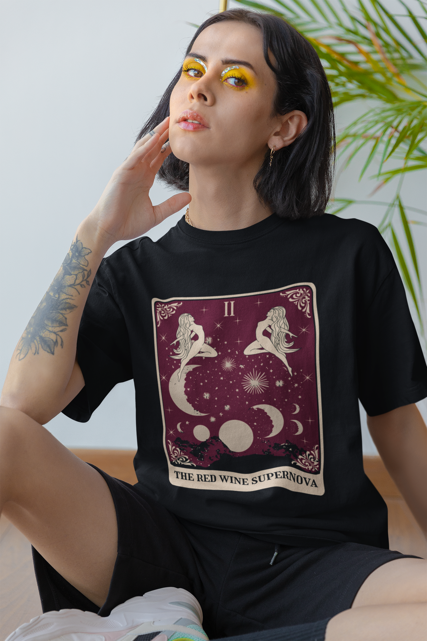 redwinetarotblackmockupsitting.png