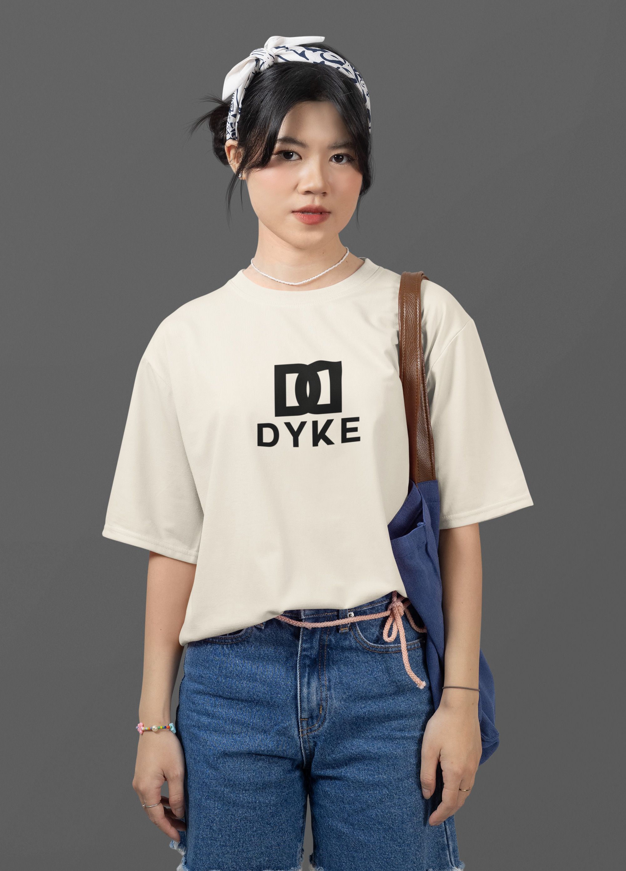 oversized-round-neck-tee-mockup-featuring-a-woman-posing-against-a-customizable-backdrop-m51456.png