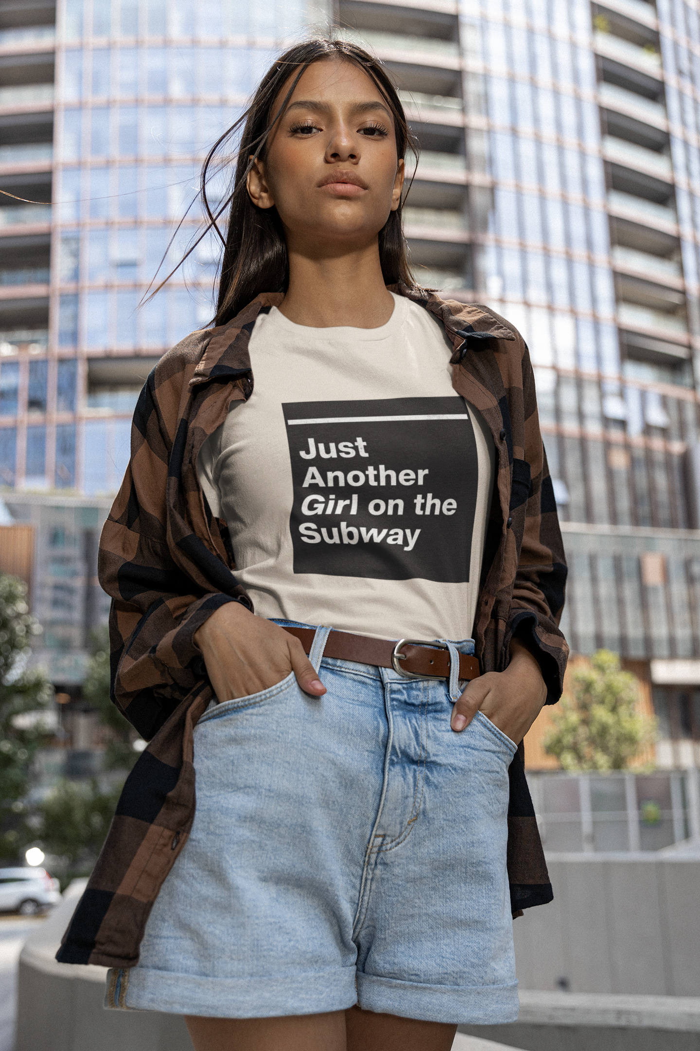 mockup-of-a-woman-posing-in-a-round-neck-bella-canvas-tee-by-a-building-m29432.png