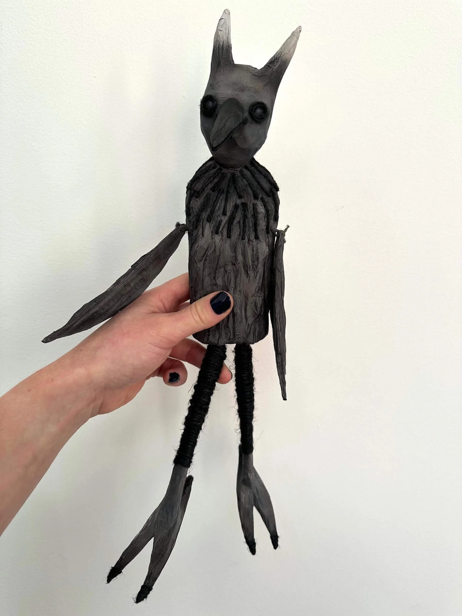Crow Creature sculpture showing movable parts
