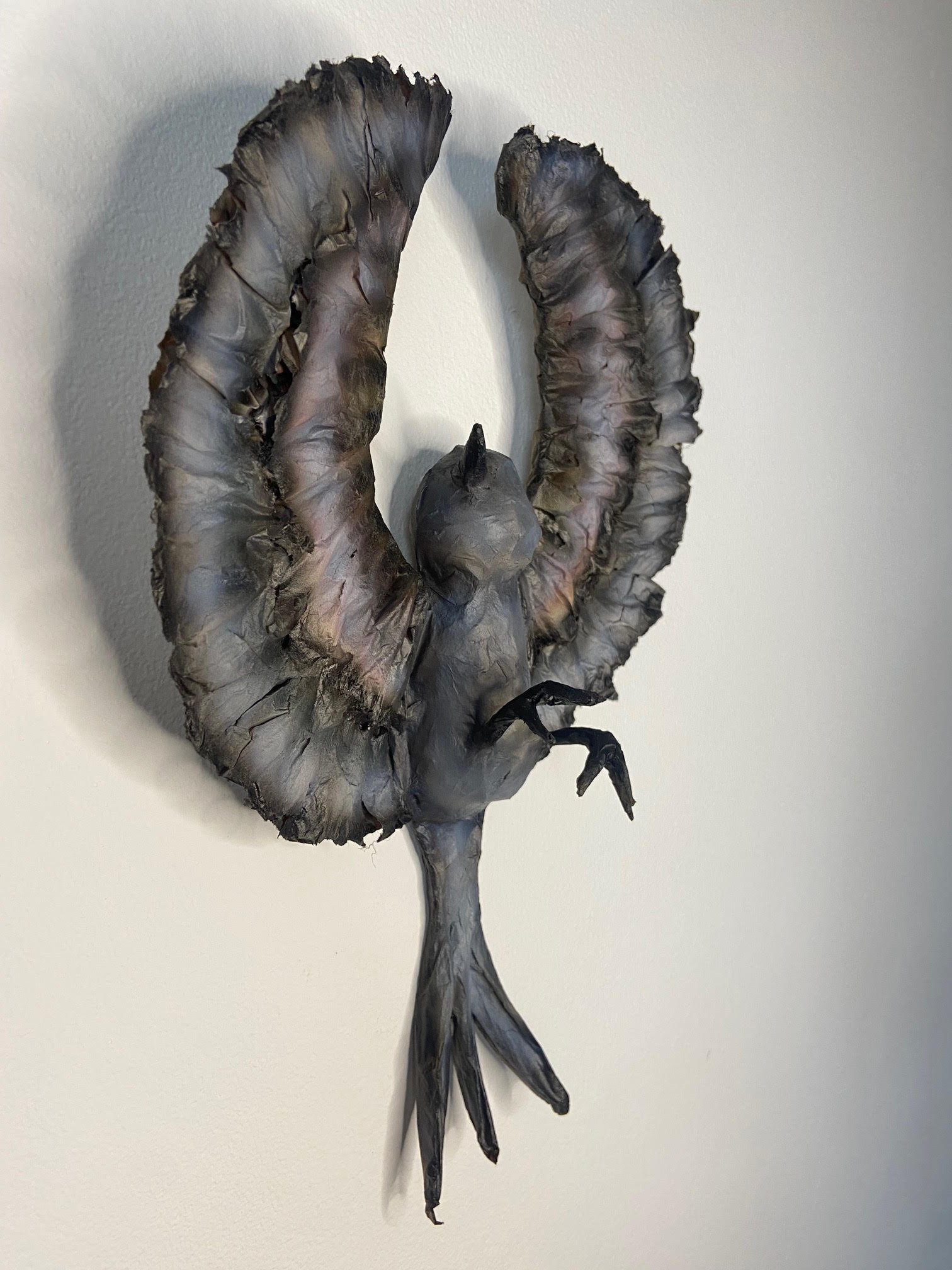 Unfolding eco-conscious sculpture by Caroline Lindqvist, made from discarded cardboard and paper