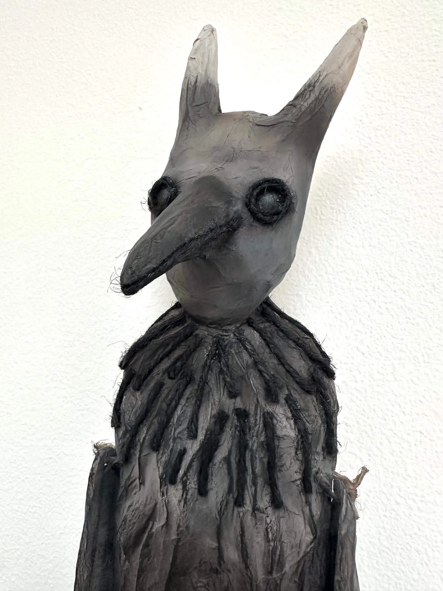 Crow Creature, cardboard and paper sculpture, close-up of head details