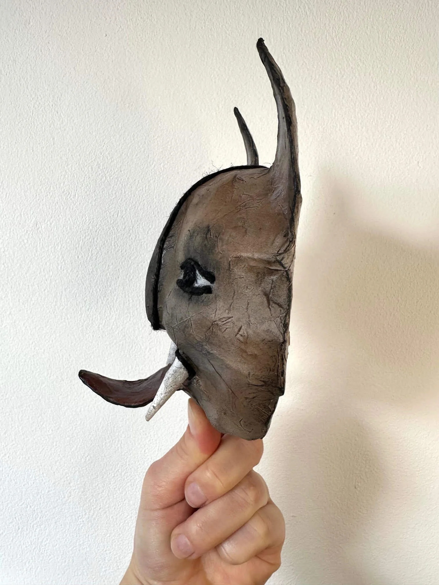 Instinct animal mask wall sculpture in profile view