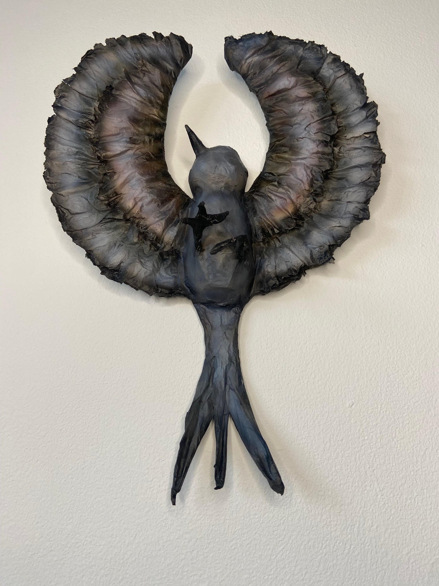 Unfolding eco-conscious sculpture by Caroline Lindqvist, made from discarded cardboard and paper