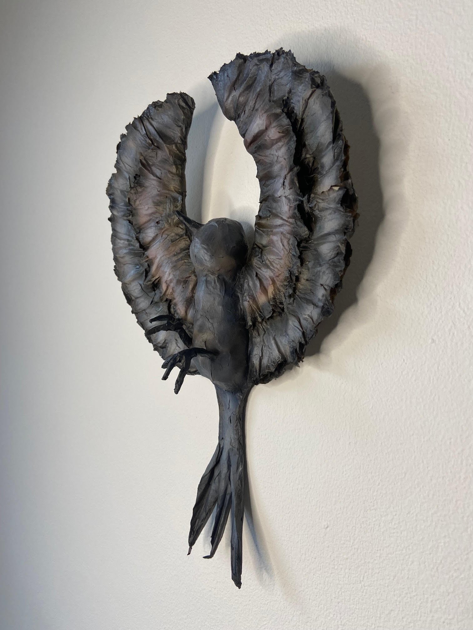 Unfolding eco-conscious sculpture by Caroline Lindqvist, made from discarded cardboard and paper