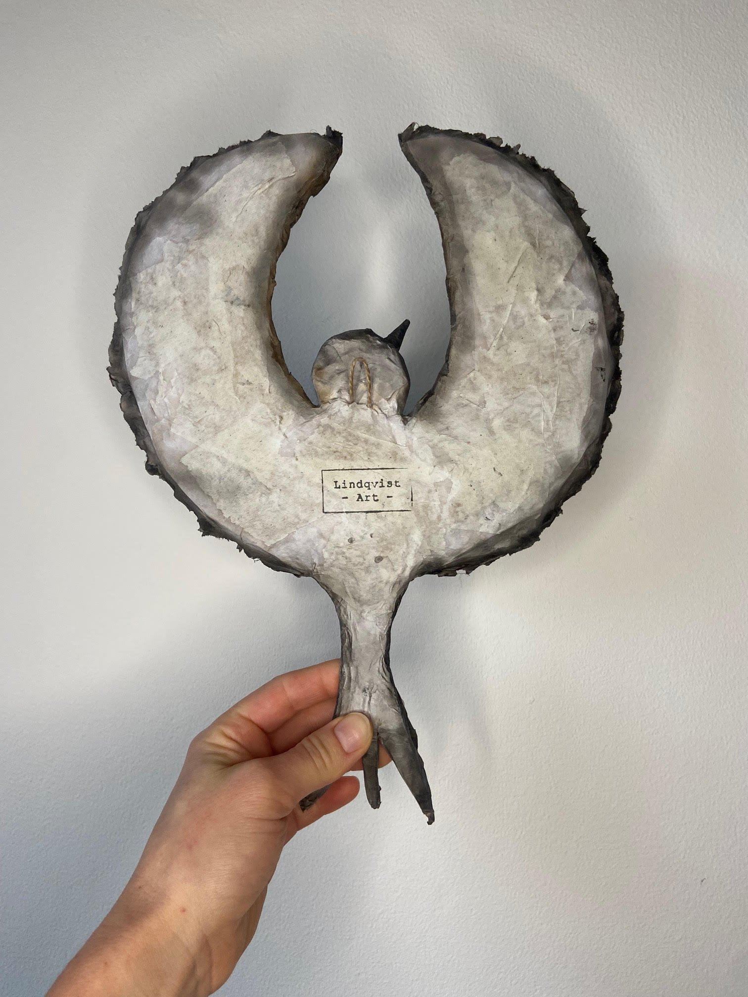 Unfolding eco-conscious sculpture by Caroline Lindqvist, made from discarded cardboard and paper
