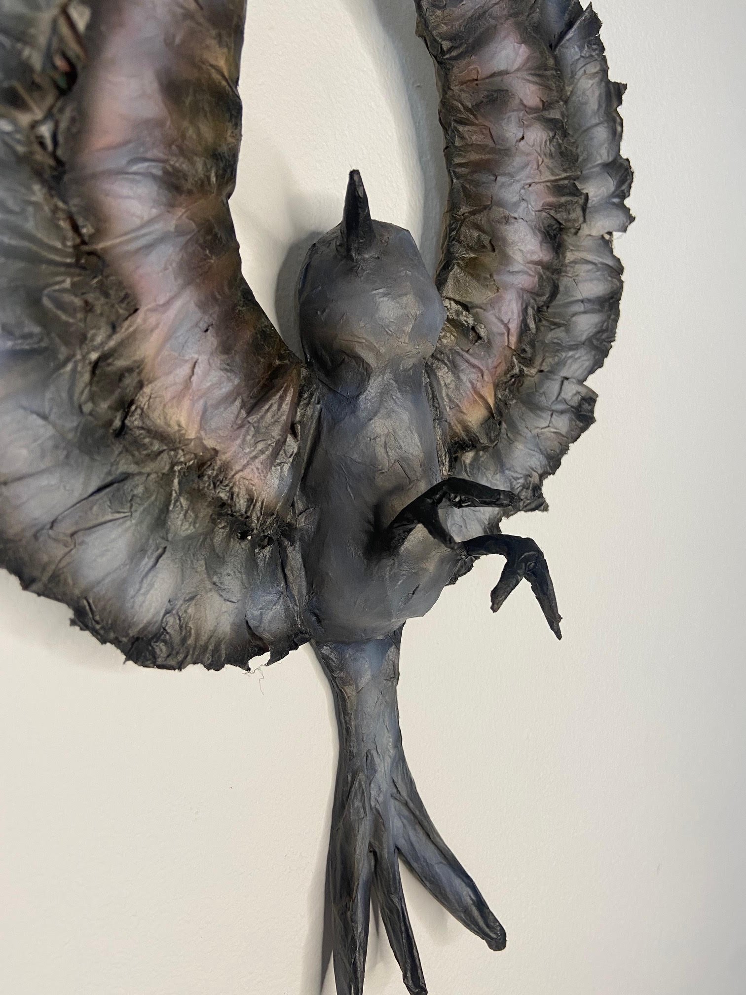 Unfolding eco-conscious sculpture by Caroline Lindqvist, made from discarded cardboard and paper
