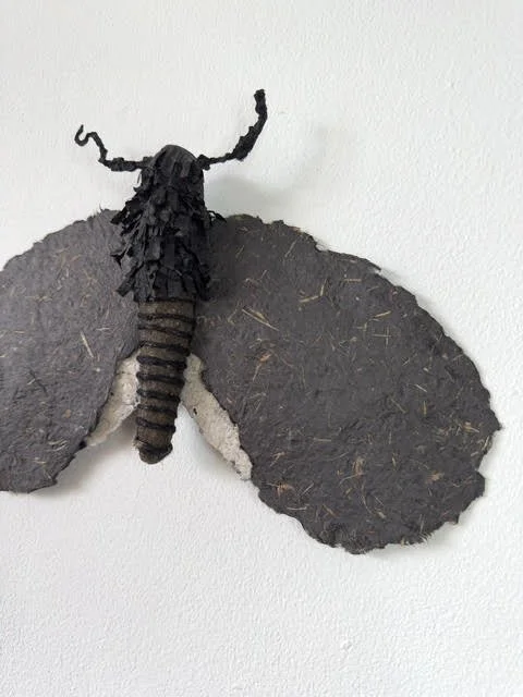Side view of moth sculpture showing details of handmade paper, made by eco-artist Caroline Lindqvist