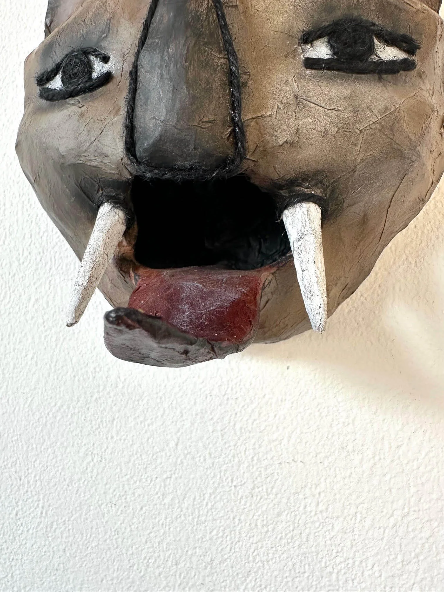 Instinct an animal wall sculpture mask, close-up of details of eco art