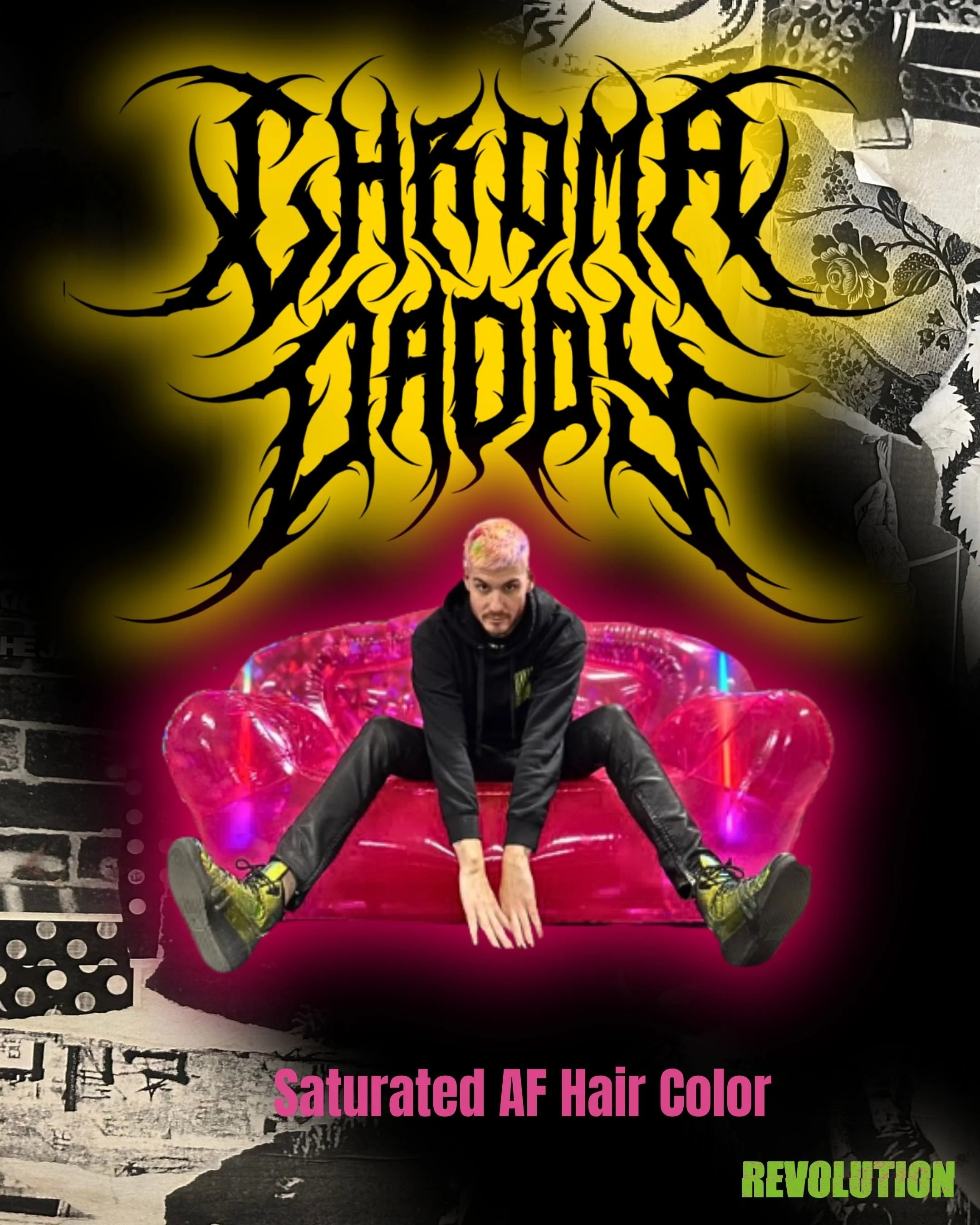 A young man with pink and yellow hair dyed in a saturated fashion sitting on a bright pink inflatable couch. The background features a black and white floral wallpaper and a brick wall. Text in the image includes 'Saturated AF Hair Color' in pink and