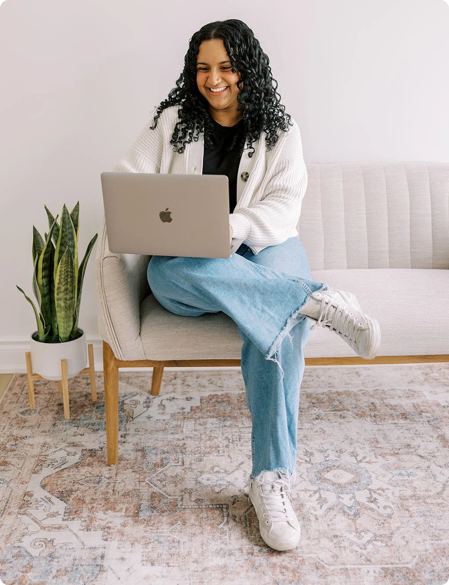 Therapist in an online therapy session using a laptop in a warm, welcoming space, symbolizing accessible mental health care, virtual counseling, and emotional well-being support.