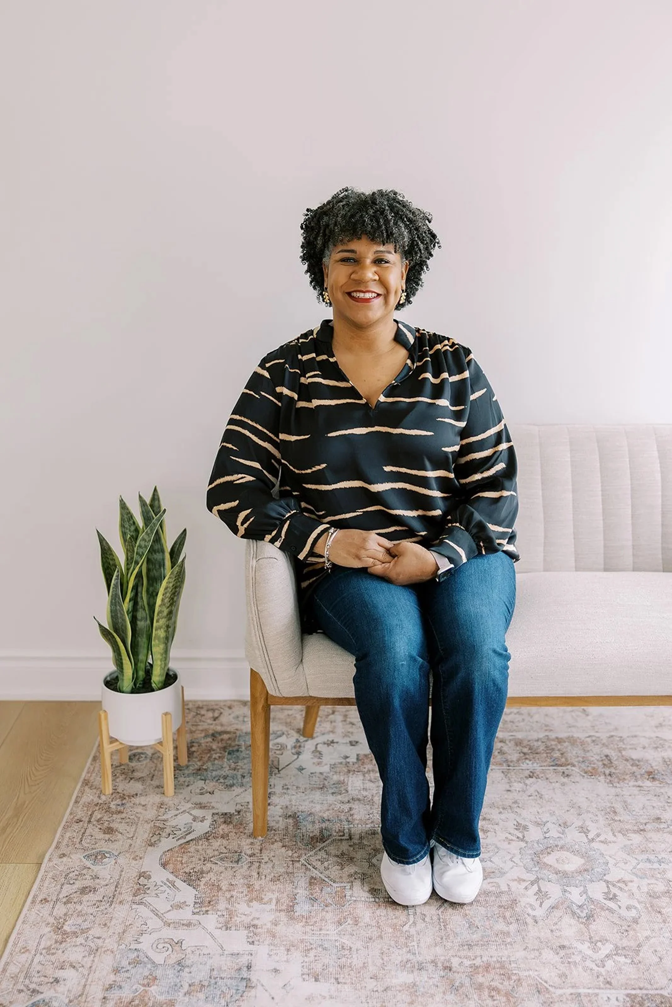 Debra Musgrave, associate therapist, sitting in a therapy office, experienced in trauma, grief counseling, and life transitions