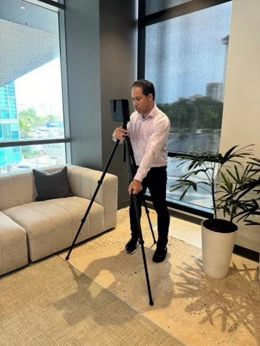 Person using a 3D scanner.