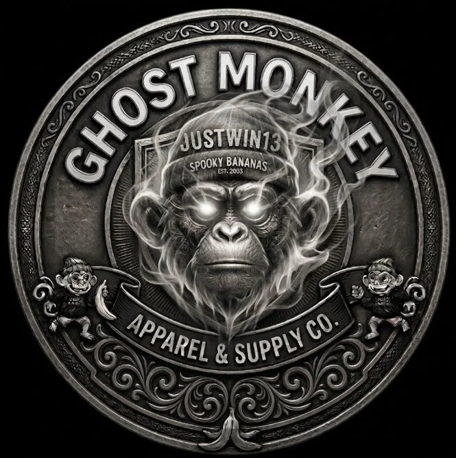 A circular logo with a fierce, glowing-eyed gorilla's face with steam or smoke around it. The text reads 'GHOST MONKEY' at the top, with 'JUSTWIN13' and 'SPOOKY BANANAS' on the gorilla's forehead. Additional text includes 'APPAREL & SUPPLY CO.' and decorative elements, all in black, white, and gray tones.