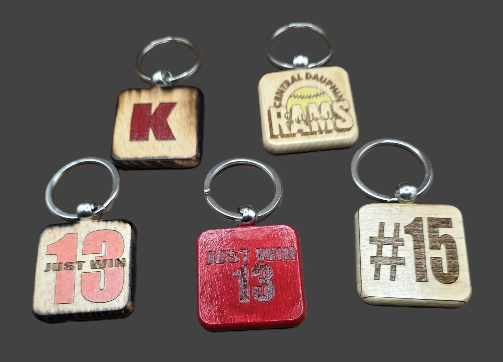 Custom Keychains – Team & Player Designs
Square wooden keychains personalized with team names, jersey numbers, initials, or motivational phrases. Great for athletes, coaches, and fans — perfect for team gifts, bag tags, or fundraiser sets.