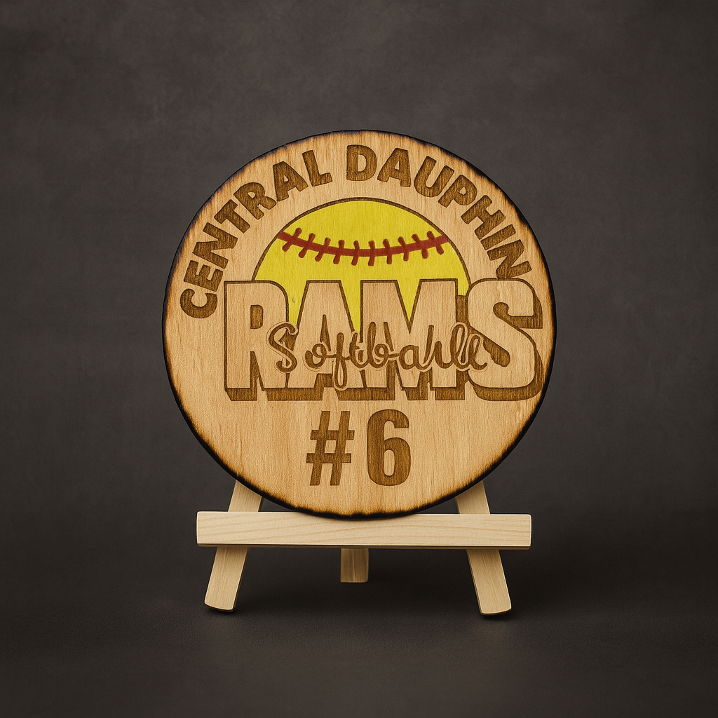 Custom Logo Round – School Spirit Engraving
Laser‑engraved 4" round featuring your school or team logo, personalized with jersey number and year. Comes with a wooden easel for display or paracord for attaching to a bag. Optional custom message engrav