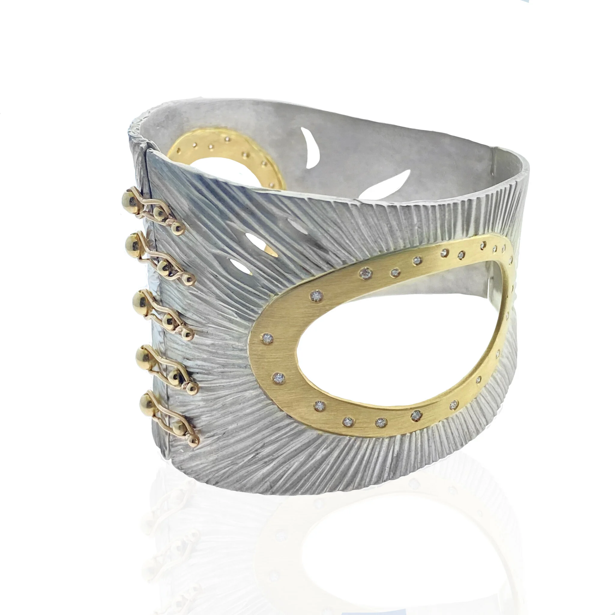 18k gold and silver orbital cuff.jpg