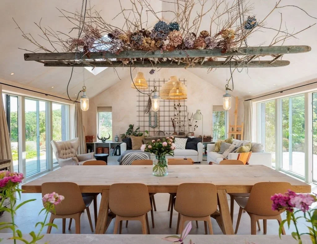   At its heart, a generous open-plan living space is designed around gathering rather than display. A 2.6 metre long stone pig trough sink, which has been shaped by the elements over years sitting in a field and a three-metre dining table by Benchmar
