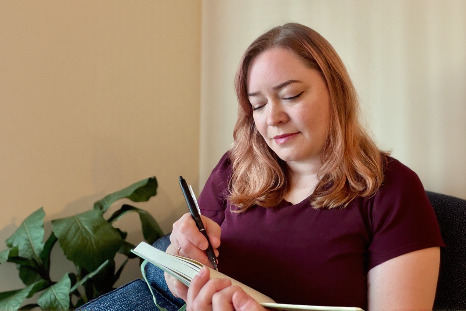 Candice Wiswell, ADHD writing coach, writing in a notebook